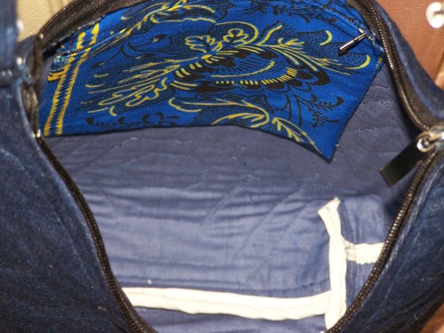 Inside view, with a colorful zipper pouch. 